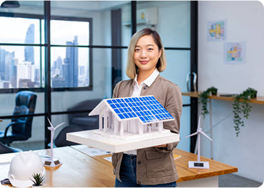Satisfied customer holding a solar model